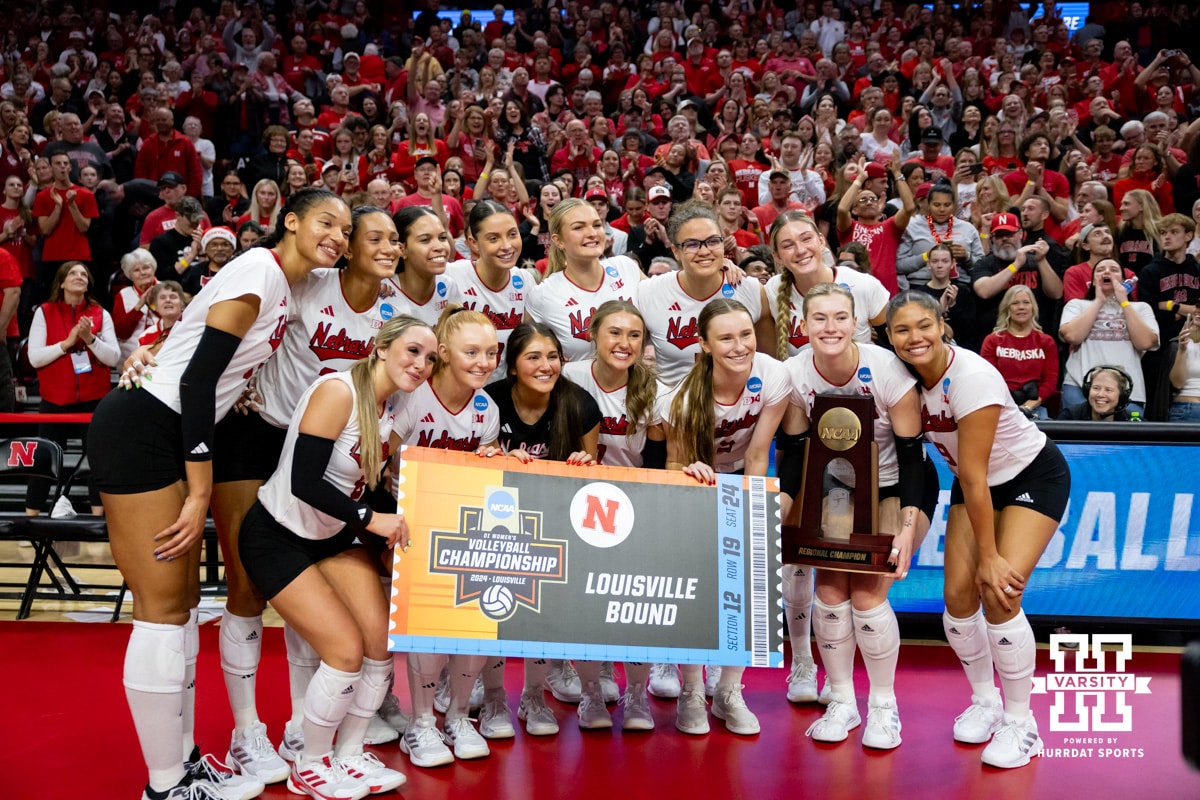 Nebraska Cornhuskers pose for a photo with the NCAA Regional Champion trophy after the win over the Wisconsin Badgers during the final regional match in the NCAA championship Sunday, December 15, 2024, in Lincoln, Nebraska. Photo by John S. Peterson.