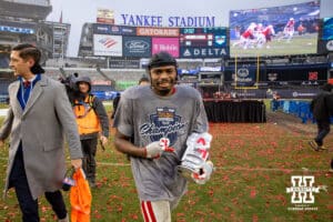 Nebraska Cornhuskers running back Rahmir Johnson (14) heads to the locker room with the MVP trophy after the win over the Boston College Eagles during the Pinstripe Bowl game, Saturday, December 28, 2024, in New York, New York. Photo by John S. Peterson.