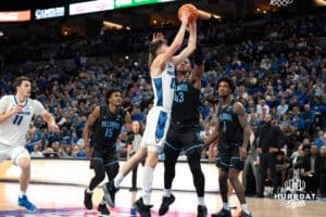 Creighton Bluejays Mason Miller (13) drives to the hoop during a college basketball game against the Villanova Wildcats on Saturday, December 21st, 2024 in Omaha Nebraska. Photo by Brandon Tiedemann.