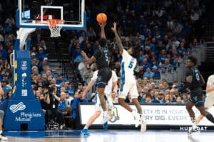 Creighton Bluejays Jamiya Neal (5) contests a shot against Villanova Wildcats Wooga Poplar (50) during a college basketball game on Saturday, December 21st, 2024 in Omaha Nebraska. Photo by Brandon Tiedemann.