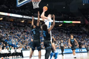 Creighton Bluejays Ryan Kalkbrenner (11) attempts a layup during a college basketball game against the Villanova Wildcats on Saturday, December 21st, 2024 in Omaha Nebraska. Photo by Brandon Tiedemann.