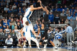 Creighton Bluejays Jasen Green (0)contests a shot against Villanova Wildcats Jordan Longino (15) during a college basketball game on Saturday, December 21st, 2024 in Omaha Nebraska. Photo by Brandon Tiedemann.