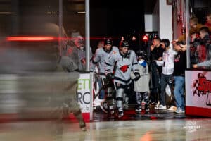 The team enters the arena during a hockey match at Baxter Arena on Saturday, December 14, 2024, in Omaha, Nebraska. Photo by Collin Stilen.