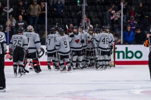 Mavericks cheer after a hard fought win against Lindenwood during a hockey match at Baxter Arena on Saturday, December 14, 2024, in Omaha, Nebraska. Photo by Collin Stilen.