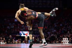 #5 Nebraska Cornhusker Anttrell Taylor throws #10 Minnesota Golden Gopher Tommy Askey during a college wrestling match, Saturday, January 11, 2025, in Lincoln, Nebraska. Taylor defeats Askey 4-1. Photo by John S. Peterson.