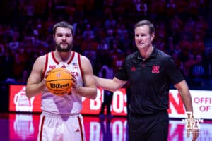 Nebraska Cornhuskers guard Rollie Worster (24) awarded a ball for a 1000 career points by Fred Hoiberg before taking on the Rutgers Scarlet Knights during a college basketball game, Thursday, January 16, 2025, in Lincoln, Nebraska. Photo by John S. Peterson.