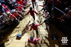 #6 Nebraska Cornhuskers make their way to the mat to take on the #1 Penn State Nittany Lions during a college wrestling match, Friday, January 17, 2025, in Lincoln, Nebraska. Photo by John S. Peterson.