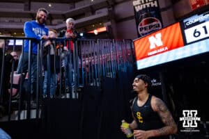 USC Trojans forward Saint Thomas (0) talks to former basketball coach from Millard North, Nick Moyer, before a college basketball game against the Nebraska Cornhuskers, Wednesday, January 22, 2025, in Lincoln, Nebraska. Photo by John S. Peterson.