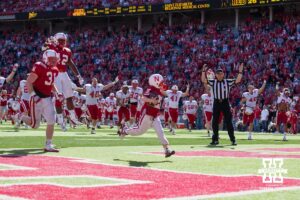 Seven year old Cornhusker Jack Hoffman (22) scores a touchdown in the fourth quarter for the Red team Saturday, April 6, 2013, at Memorial Stadium in Lincoln, Nebraska. Photo John S. Peterson.