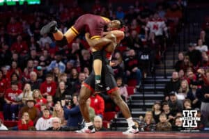 #5 Nebraska Cornhusker Anttrell Taylor picks up #10 Minnesota Golden Gopher Tommy Askey during a college wrestling match, Saturday, January 11, 2025, in Lincoln, Nebraska. Taylor defeats Askey 4-1. Photo by John S. Peterson.