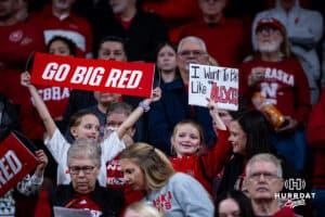 Nebraska Cornhuskers fans holding signs during a college basketball game against the Ohio State Buckeyes, Sunday, January 26, 2025, in Lincoln, Nebraska. Photo by John S. Peterson.