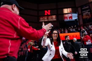 Nebraska Cornhuskers head coach Amy Williams gives a fan five before taking on the Wisconsin Badgers during a college basketball game, Monday, January 20, 2025, in Lincoln, Nebraska. Photo by John S. Peterson.