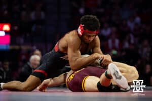 Nebraska Cornhusker Christopher Minto wrestles against #9 Minnesota Golden Gopher Andrew Sparks during a college wrestling match, Saturday, January 11, 2025, in Lincoln, Nebraska. Minto upsets Sparks 5-4. Photo by John S. Peterson.