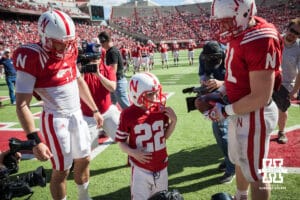 Nebraska Cornhuskers Jack Hoffman, Taylor Martinez (3), and C.J. Zimmerer (31) celebrating Jack's touchdown as the media gathers around during the Red-White spring game Saturday, April 6, 2013 in Memorial Stadium. Photo by John S. Peterson.