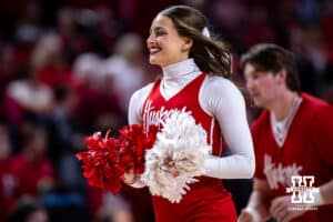 Nebraska Cornhuskers cheer squad member run off the court against the Wisconsin Badgers during a college basketball game, Monday, January 20, 2025, in Lincoln, Nebraska. Photo by John S. Peterson.