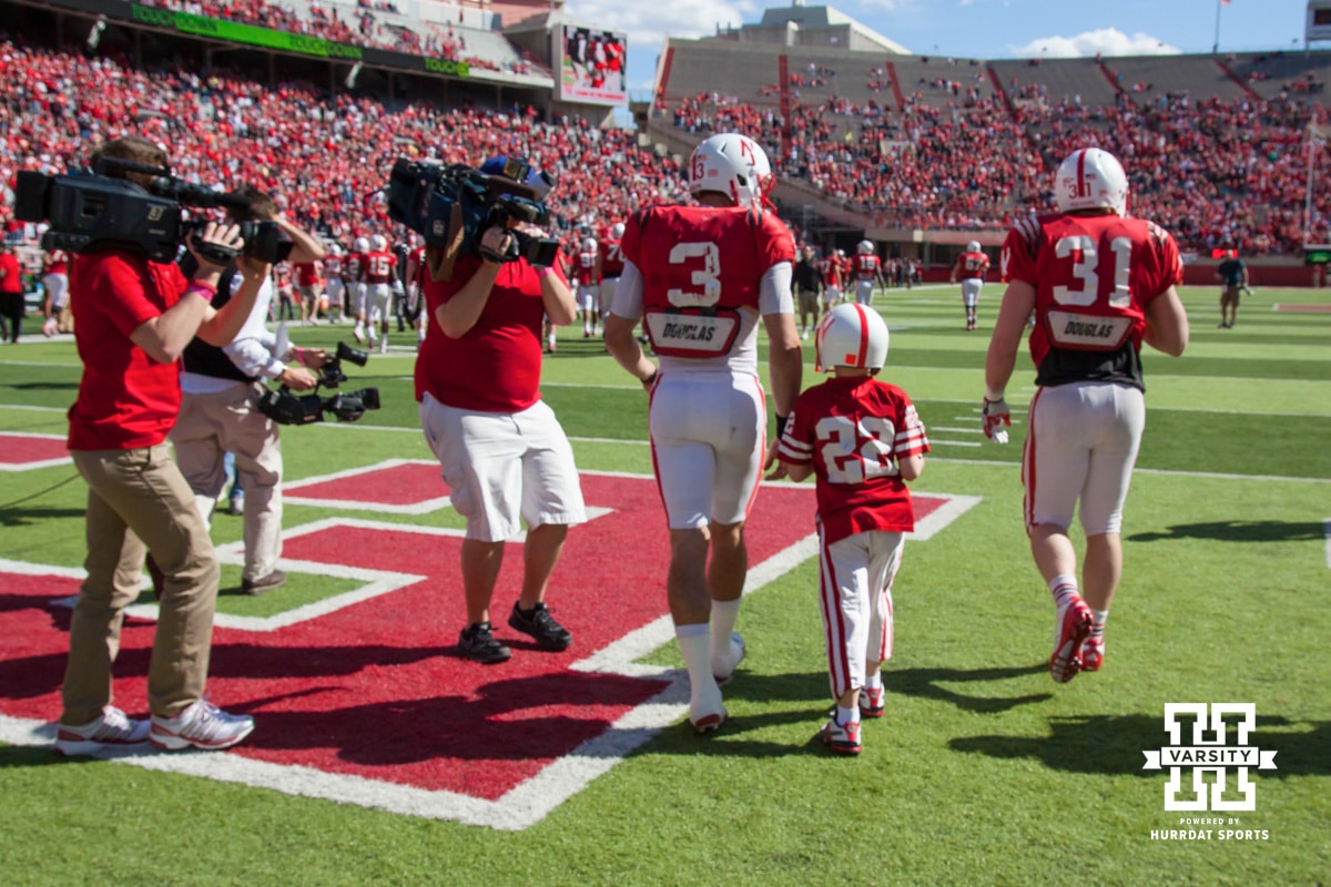 Taylor Martinez #3 walks Jack Hollman (22) off the field after Jack scores a touchdown for the Red team during Red-White spring game Saturday, April 6, 2013 in Memorial Stadium. Photo by John S. Peterson.