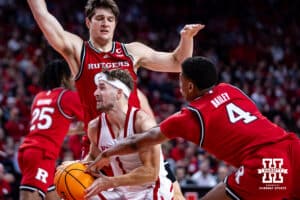 Nebraska Cornhuskers guard Sam Hoiberg (1) drives the ball between Rutgers Scarlet Knights guard Ace Bailey (4) and Zach Martini in the first half during a college basketball game, Thursday, January 16, 2025, in Lincoln, Nebraska. Photo by John S. Peterson.