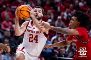 Nebraska Cornhuskers guard Rollie Worster (24) drives to the lane against Rutgers Scarlet Knights guard Jamichael Davis (1) in the first half during a college basketball game, Thursday, January 16, 2025, in Lincoln, Nebraska. Photo by John S. Peterson.