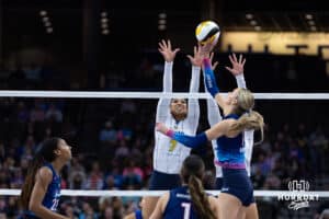 Omaha Supernovas Ally Batenhorst (14) tips the ball over the net against San Diego Mojo Ronika Stone (7) during a professional volleyball match, Sunday, January 19, 2025, in Omaha, Nebraska. Photo by John S. Peterson.