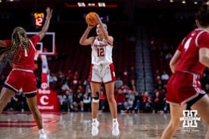 Nebraska Cornhuskers forward Jessica Petrie (12) makes a three-point shot against Wisconsin Badgers center Carter McCray (1) during a college basketball game, Monday, January 20, 2025, in Lincoln, Nebraska. Photo by John S. Peterson.