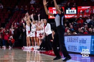 Nebraska Cornhuskers bench celebrates a three-point shot against the Wisconsin Badgers during a college basketball game, Monday, January 20, 2025, in Lincoln, Nebraska. Photo by John S. Peterson.