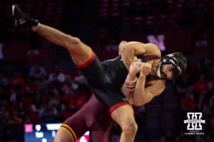 #6 Nebraska Cornhusker Silas Allred gets thrown against #4 Minnesota Golden Gopher Max McEnelly during a college wrestling match, Saturday, January 11, 2025, in Lincoln, Nebraska. McEnelly defeats Allred 16-6. Photo by John S. Peterson.