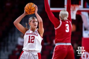 Nebraska Cornhuskers forward Jessica Petrie (12) looks for the open pass agaisnt Wisconsin Badgers guard Tess Myers (3) during a college basketball game, Monday, January 20, 2025, in Lincoln, Nebraska. Photo by John S. Peterson.