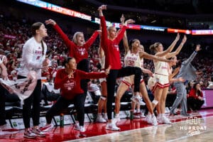 Nebraska Cornhuskers bench celebrates a three-point shot against the Ohio State Buckeyes in the third quarter during a college basketball game, Sunday, January 26, 2025, in Lincoln, Nebraska. Photo by John S. Peterson.