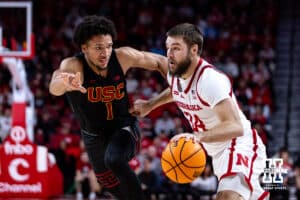 Nebraska Cornhuskers guard Rollie Worster (24) dribbles the ball against USC Trojans guard Desmond Claude (1) in the first half during a college basketball game, Wednesday, January 22, 2025, in Lincoln, Nebraska. Photo by John S. Peterson.