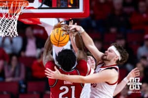 Nebraska Cornhuskers forward Andrew Morgan (23) and Connor Essegian go for the rebound against Rutgers Scarlet Knights center Emmanuel Ogbole (21) in the second half during a college basketball game, Thursday, January 16, 2025, in Lincoln, Nebraska. Photo by John S. Peterson.