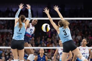 Omaha Supernovas opposite hitter Kelsie Payne (11) spikes the ball between Atlanta Vibe outside hitter Pia Timmer (7) and middle blocker Shelly Fanning (3) during a professional volleyball match, Friday, January 10, 2025, in Omaha, Nebraska. Photo by John S. Peterson.