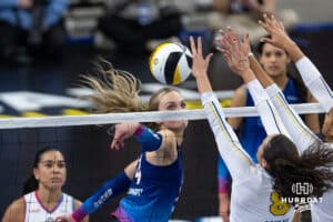 Omaha Supernovas Ally Batenhorst (14) hits the ball passed San Diego Mojo Kendra Dahlke (8) during a professional volleyball match, Sunday, January 19, 2025, in Omaha, Nebraska. Photo by John S. Peterson.