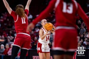 Nebraska Cornhuskers guard Callin Hake (14) makes a three-point shot against Wisconsin Badgers forward Jovana Spasovski (11) during a college basketball game, Monday, January 20, 2025, in Lincoln, Nebraska. Photo by John S. Peterson.