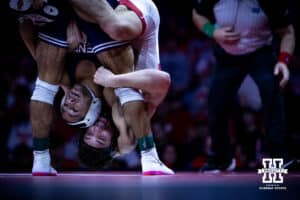 Nebraska's Ridge Lovett hangs on Penn State's Shayne Van Ness at 149lbs during a college wrestling match, Friday, January 17, 2025, in Lincoln, Nebraska. Photo by John S. Peterson.