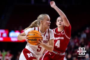 Nebraska Cornhuskers guard Alberte Rimdal (5) drives to the basket against Wisconsin Badgers guard Lily Krahn (4) during a college basketball game, Monday, January 20, 2025, in Lincoln, Nebraska. Photo by John S. Peterson.