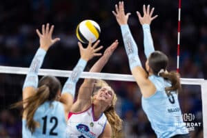 Omaha Supernovas outside hitter Brooke Nuneviller (5) spikes the ball against Atlanta Vibe middle blocker McKenna Vicini (12) and opposite hitter Merritt Beason (5) during a professional volleyball match Friday, January 10, 2025, in Omaha, Nebraska. Photo by John S. Peterson.