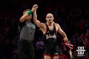 #6 Nebraska Cornhusker Brock Hardy celebrates the win on #8 Minnesota Golden Gopher Vance Vombaur during a college wrestling match, Saturday, January 11, 2025, in Lincoln, Nebraska. Hardy defeats Vombaur 12-10. Photo by John S. Peterson.