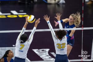 Omaha Supernovas Ally Batenhorst (14) spikes the ball against San Diego Mojo Ronika Stone (7) and Lauren Page (32) during a professional volleyball match, Sunday, January 19, 2025, in Omaha, Nebraska. Photo by John S. Peterson.