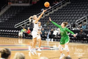 Omaha Mavericks Grace Cave shoots a three pointer during a college basketball game against North Dakota on January 2nd, 2025 in Omaha Nebraska. Photo by Brandon Tiedemann.