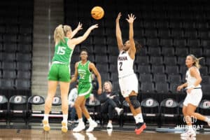 Omaha Mavericks Lauren Perry contests a shot during a college basketball game against North Dakota on January 2nd, 2025 in Omaha Nebraska. Photo by Brandon Tiedemann.