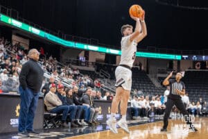 Omaha Mavericks Tony Osburn shooting a three pointer during a college basketball game against Kansas City on January 8th, 2025 in Omaha Nebraska. Photo by Brandon Tiedemann.