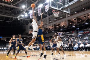 Omaha Mavericks Lance Waddles attempts a contested layup during a college basketball game against Kansas City on January 8th, 2025 in Omaha Nebraska. Photo by Brandon Tiedemann.