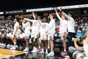 Omaha Mavericks bench celebrates a basket during a college basketball game against Kansas City on January 8th, 2025 in Omaha Nebraska. Photo by Brandon Tiedemann.