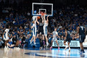 Creighton Bluejays Jackson McAndrew and Ryan Kalkbrenner defend a shot during a college basketball game against Xavier on January 29th, 2025 in Omaha Nebraska. Photo by Brandon Tiedemann.