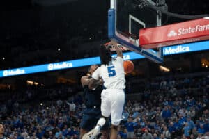 Creighton Bluejays Jamiya Neal dunks on a defender during a college basketball game against Xavier on January 29th, 2025 in Omaha Nebraska. Photo by Brandon Tiedemann.