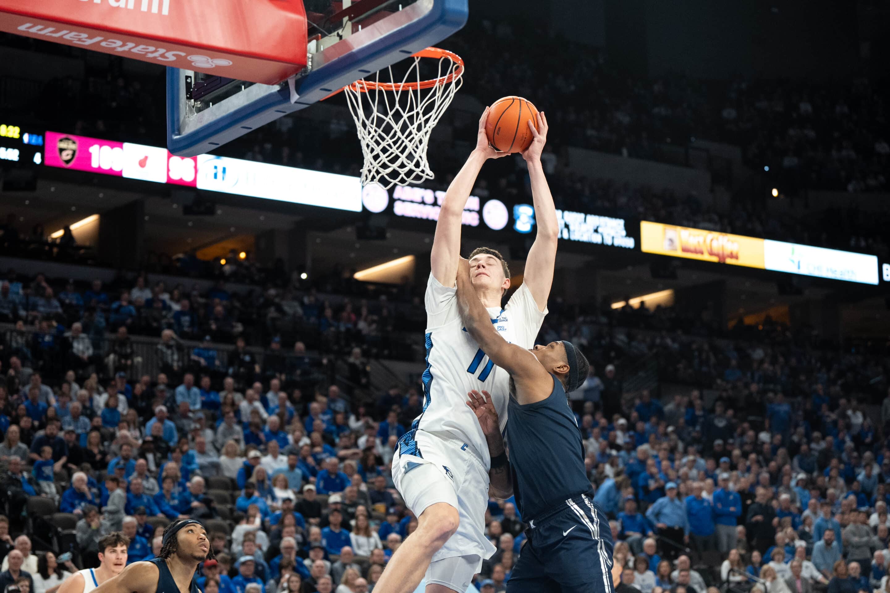 Creighton Bluejays Ryan Kalkbrenner looks to dunk during a college basketball game against Xavier on January 29th, 2025 in Omaha Nebraska. Photo by Brandon Tiedemann.