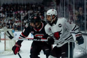 Omaha Maverick Chase LaPinta goes head-to-head with opponent during a hockey match at Baxter Arena on Saturday, January 25, 2025, in Omaha, Nebraska. Photo by Collin Stilen.