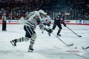 Omaha Maverick Charlie Lurie takes a shot during a hockey match at Baxter Arena on Saturday, January 25, 2025, in Omaha, Nebraska. Photo by Collin Stilen.