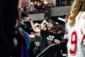 Omaha Maverick fan waving the towel that was given pregame to all fans during a hockey match at Baxter Arena on Saturday, January 25, 2025, in Omaha, Nebraska. Photo by Collin Stilen.