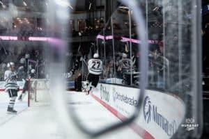 Omaha Maverick Liam Watkins jumps for joy as he celebrates with the fans against the glass during a hockey match at Baxter Arena on Saturday, January 25, 2025, in Omaha, Nebraska. Photo by Collin Stilen.